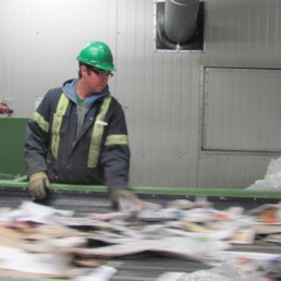 man sorting recycling